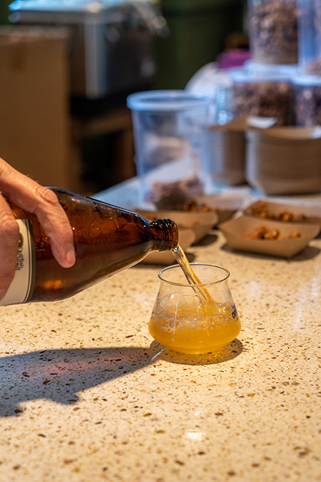 A photo of a 40 ounce bottle of malt liquor being poured