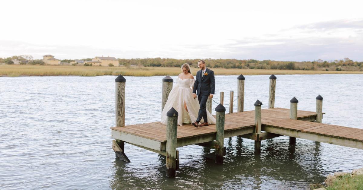 bride and groom on a pier 