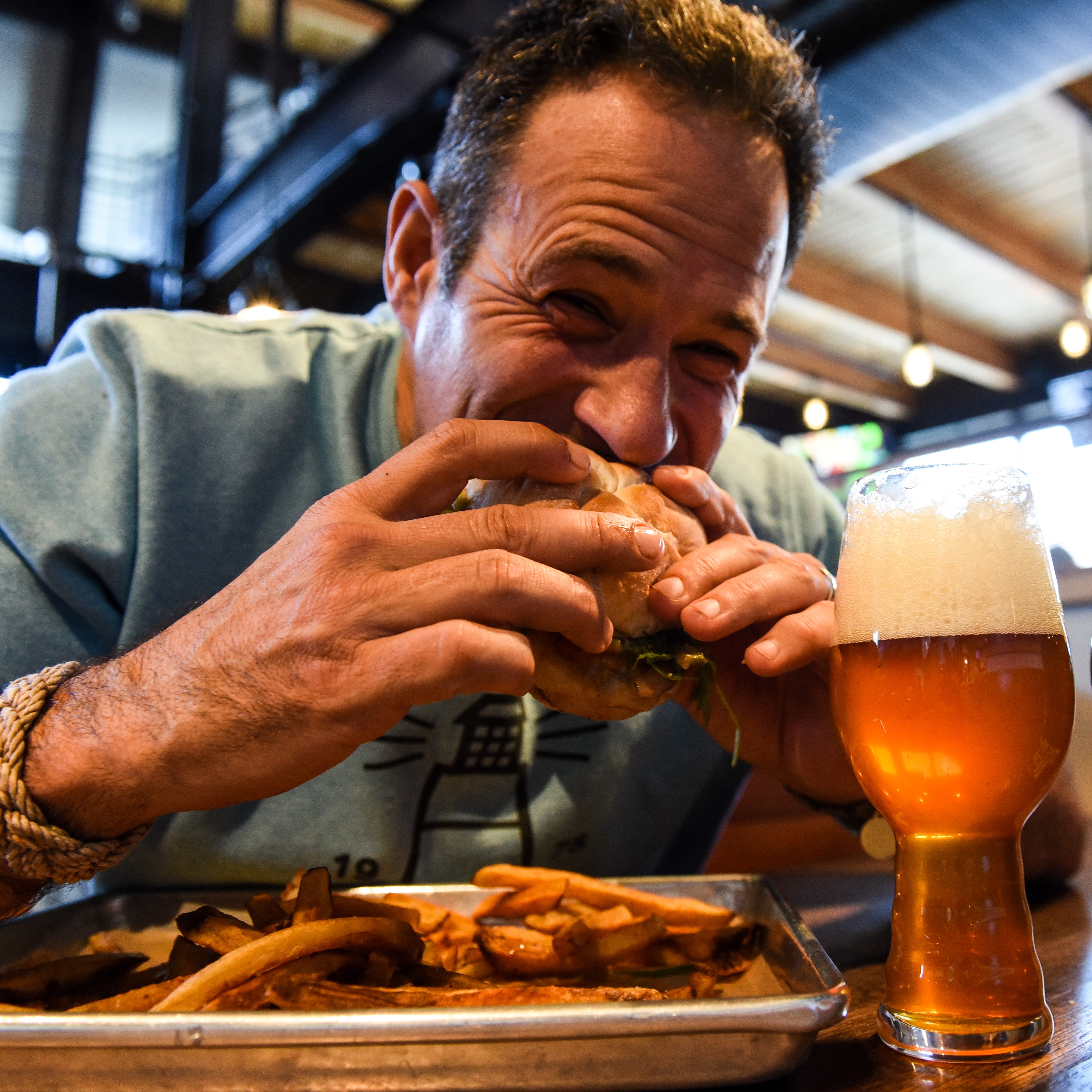 Sam Calagione eating burger