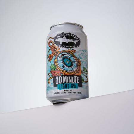 12 oz can of Dogfish Head 30 Minute Light IPA on a white surface with a white background