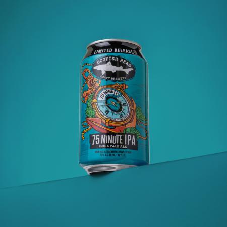 Dogfish Head 75 Minute IPA 12 oz can on a blue ledge with a blue background