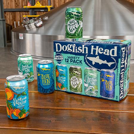 Dogfish Head Summer Variety Pack sitting on a table. The pack include 60 Minute IPA, Blue Hen Pilsner, SeaQuench Ale, and Festina Pêche 