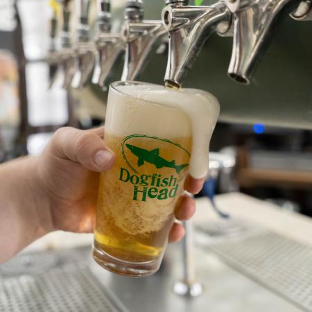 Blue Hen Pilsner being poured on tap