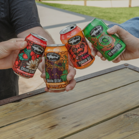 Dogfish Head Fall / Rewind Variety Pack with hands cheersing the cans
