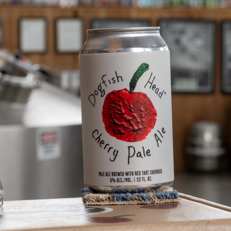 Dogfish Head Cherry Pale Ale 12oz can with a casette tape and a Dogfish Head brewing since '96 sticker