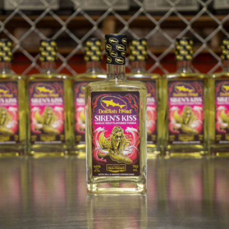 A photo of multiple bottles of green kelp vodka called Siren's Kiss 