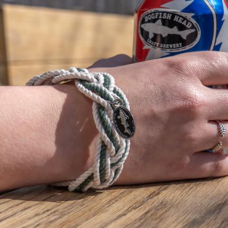 Dogfish Head Rope Bracelet with Charm photographed on wrist with a Grateful Dead collaboration beer can