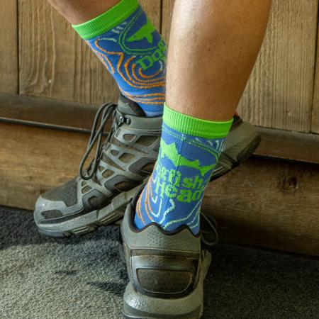 Dogfish Head Blue Topographic Socks Worn By A Model In Tennis Shoes Showing Their Comfort and Durability