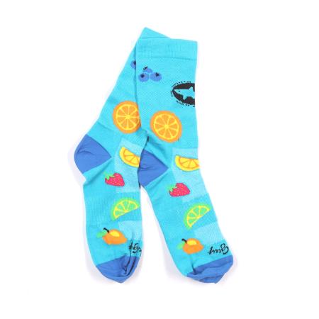 Pair of bright blue Dogfish Head socks with colorful fruit designs including orange slices, lemon wedges, strawberries, mangoes, and blueberries, with darker blue heels and toes.