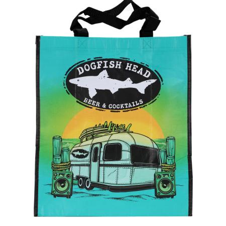 Reusable shopping tote with Dogfish Head Beer & Cocktails branding, featuring a retro trailer and sunset design on the front and colorful Dogfish Head logo patterns on the sides.