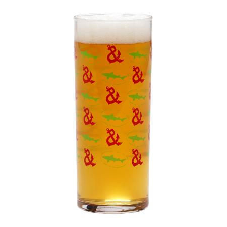Narrow collins glass with step & repeat Shark and Shield and Chesapeake & Maine anchor logo.