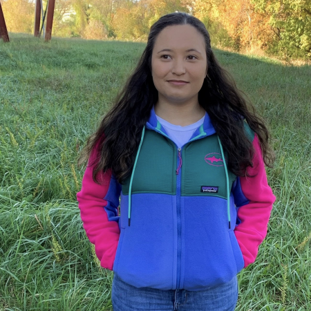 Dogfish Head and Patagonia Women's Blue and Green Microdini Hoody With Pink Sleeves Front Facing on Model