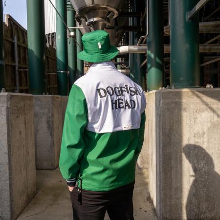 Back side of the green and white Boathouse pullover jacket with the Dogfish Head logo across the back.