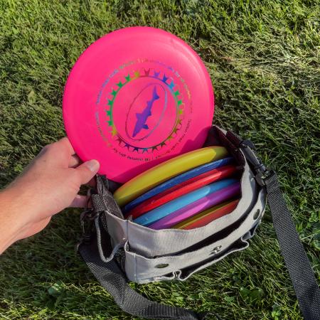 Dogfish Head Driver Discs in Pink, Red, Orange, Yellow, Blue, and Purple in a Disc Golf Bag