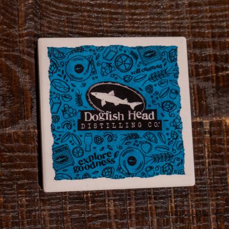 Front of coaster featuring shark logo and Dogfish Head Distilling Co.