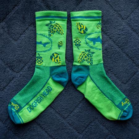 Side by side flat lay of lime green hop socks