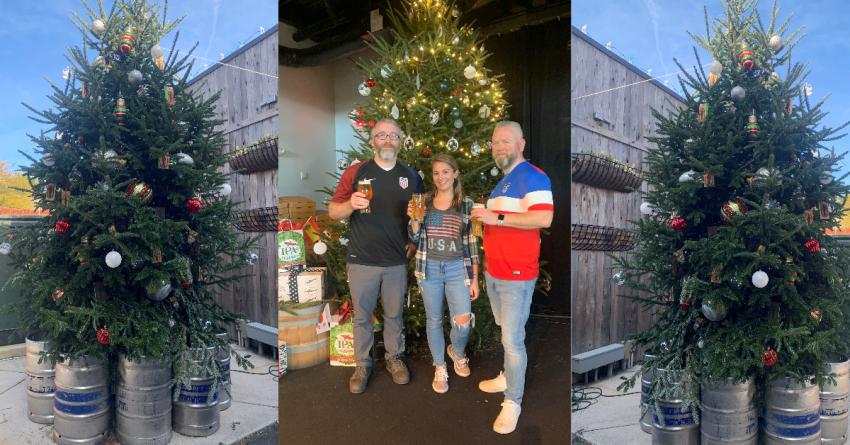 Christmas trees with kegs under, three individuals holding beers