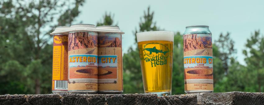 Asteroid City Lager cans & Dogfish Head pint glass