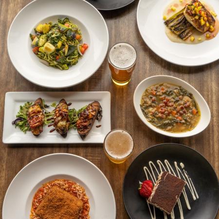 Dogfish Head Brewings & Eats menu for Rehoboth Restaurant Week 2024. Appetizers, entrees, desserts, and beer on a table