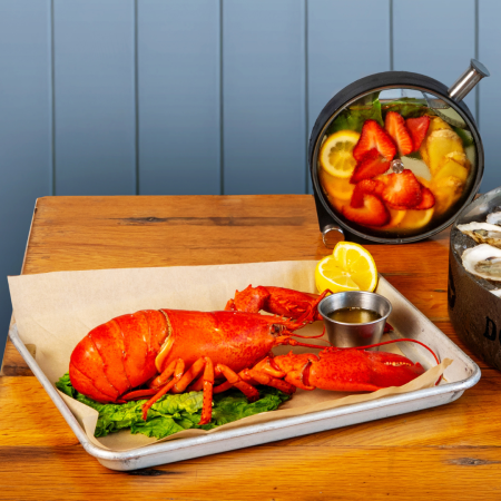 A photo of a lobster and porthole cocktail at Dogfish Head Chesapeake & Maine