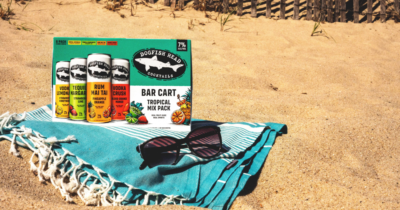Dogfish Head Bar Cart Tropical Mix Pack of cocktails on a beach in Delaware 
