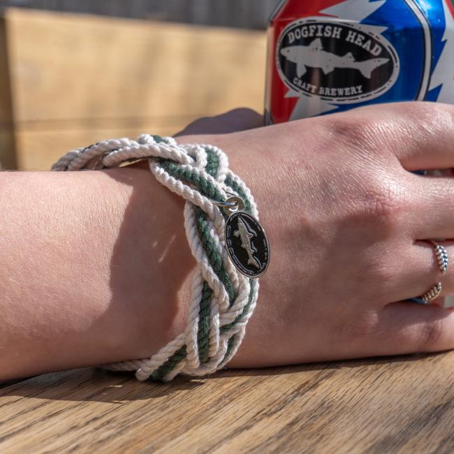 Dogfish Head Rope Bracelet with Charm photographed on wrist with a Grateful Dead collaboration beer can