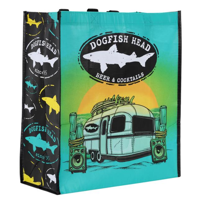 Reusable shopping tote with Dogfish Head Beer & Cocktails branding, featuring a retro trailer and sunset design on the front and colorful Dogfish Head logo patterns on the sides.