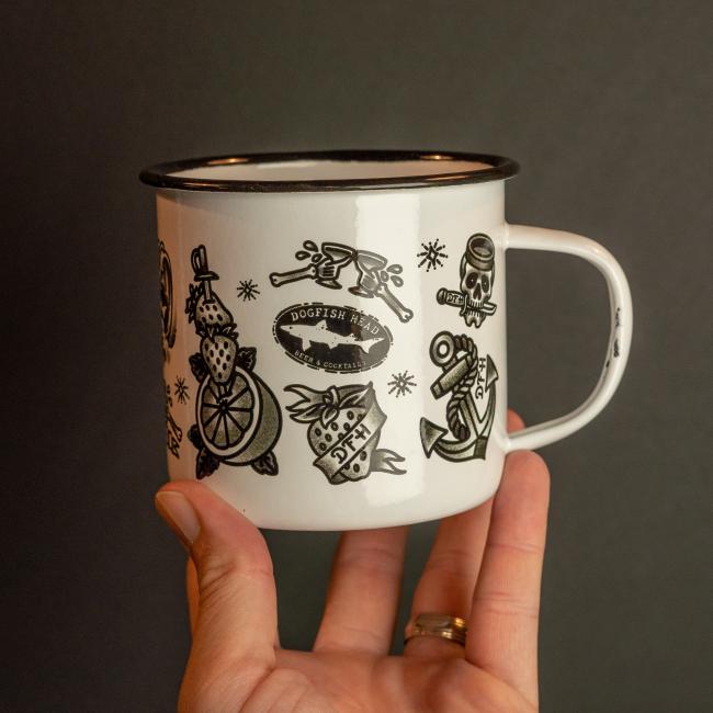 white enamel mug featuring black all over tattoo art 