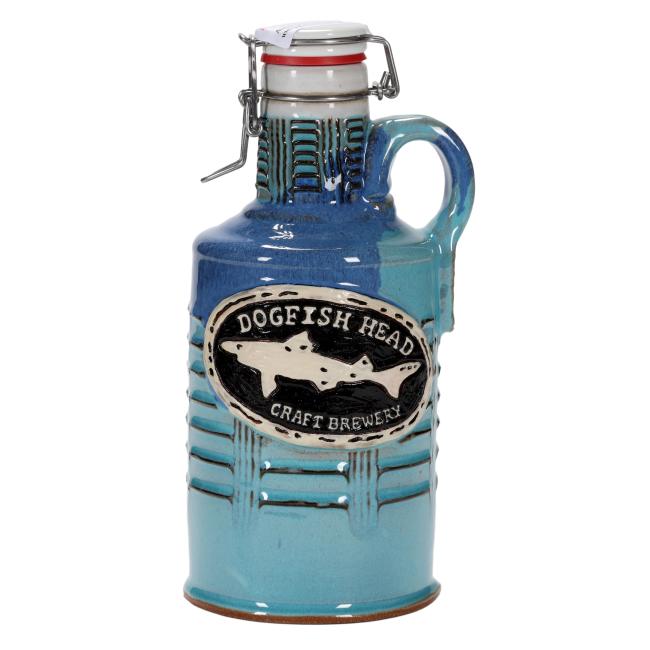 Front view of a ceramic Dogfish Head growler with a raised black and cream brewery logo and blue glaze.