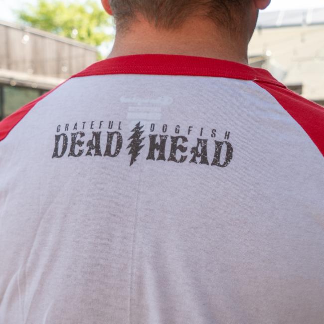 Close-up of the back neckline of the tee showing the text “GRATEFUL DOGFISH DEAD HEAD” with a distressed lightning bolt in the center, printed just below the collar.