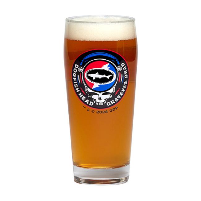 A pint glass with the Dogfish Head x Grateful Dead collaboration logo on the front. Pictured here full of beer.