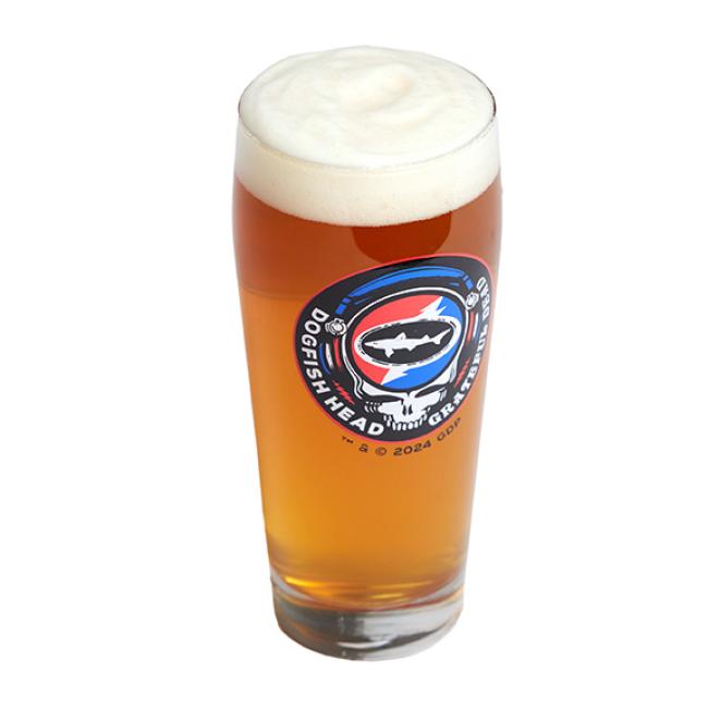 A pint glass with the Dogfish Head x Grateful Dead collaboration logo on the front. Pictured here full of beer.