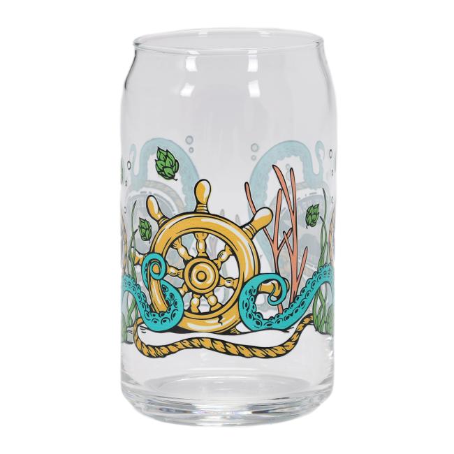 Back of the empty Dogfish Head can glass with an illustrated golden ship wheel, surrounded by seaweed, hop cones, and curling octopus arms.
