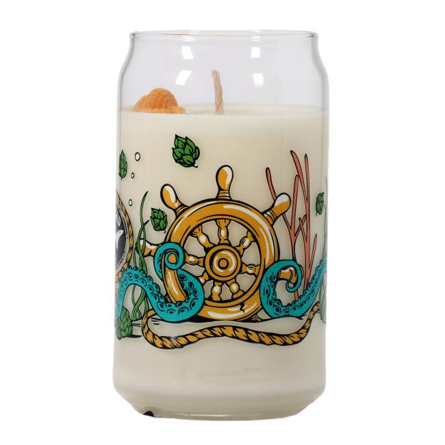 Glass filled candle featuring multi color under the see graphics. Yellow Shell wax decoration on top of candle.
