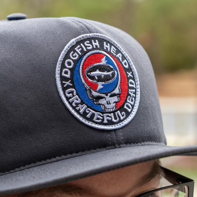 Close up shot of 3D embroidered patch with Dogfish Head x Grateful Dead collaboration logo
