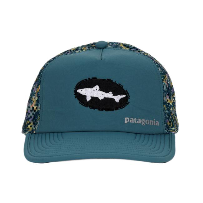 Front view of a teal Patagonia trucker hat featuring a black oval patch with a white Dogfish Head shark logo and the word