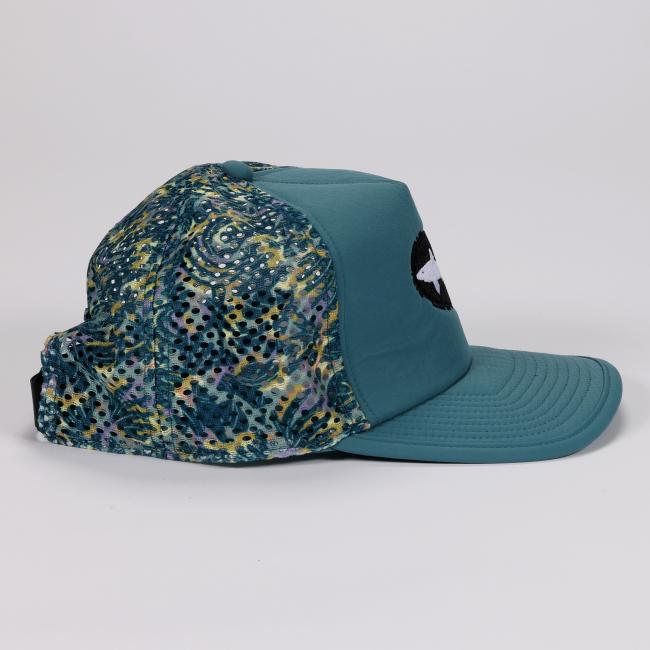 Right side profile of the hat emphasizing the teal front panel, structured bill, and vibrant patterned mesh side and back panels.