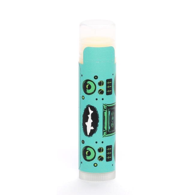 A turquoise lip balm tube featuring a retro black-and-green boombox graphic.