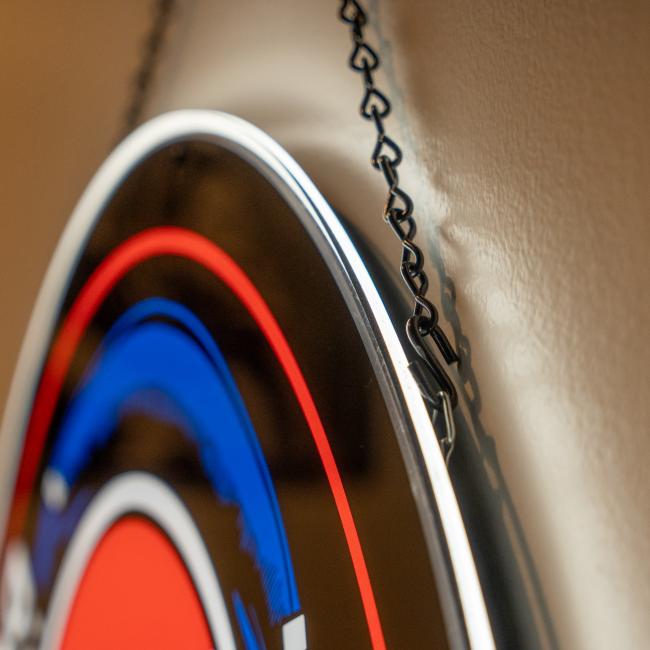 Close up view of the top of the LED sign of the Dogfish Head and Grateful Dead collaboration logo. Shows the chain used to hold up the sign.