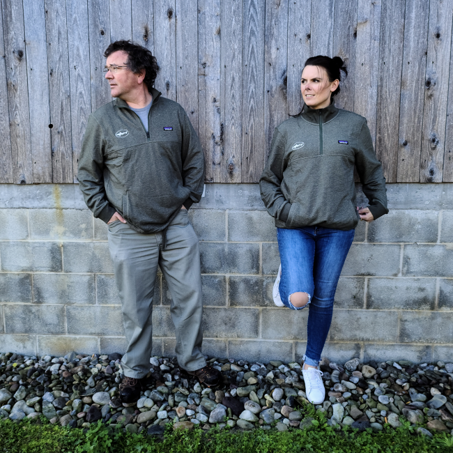 Dogfish Head and Patagonia Mahnya Fleece Pullover On a Male and Female Model Outside
