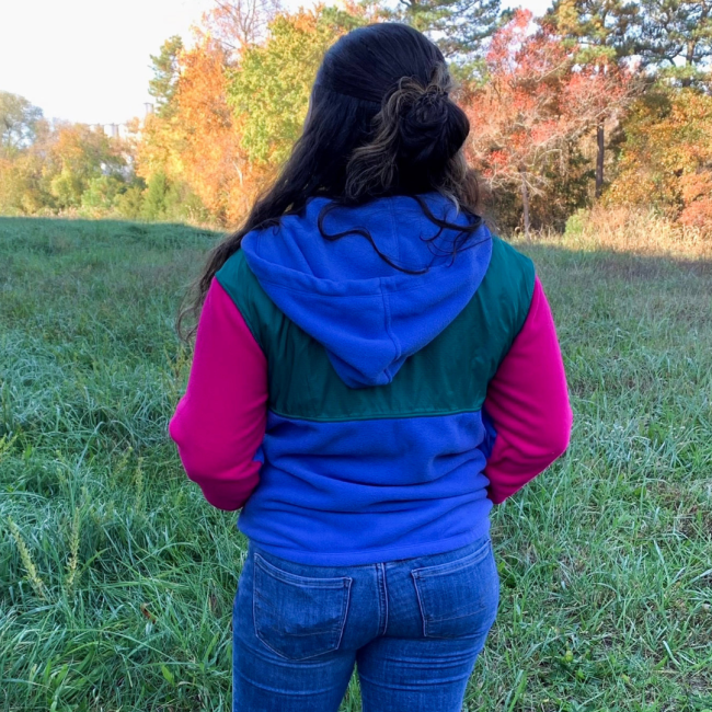 Dogfish Head and Patagonia Women's Blue and Green Microdini Hoody With Pink Sleeves View of Back with Hood on Model
