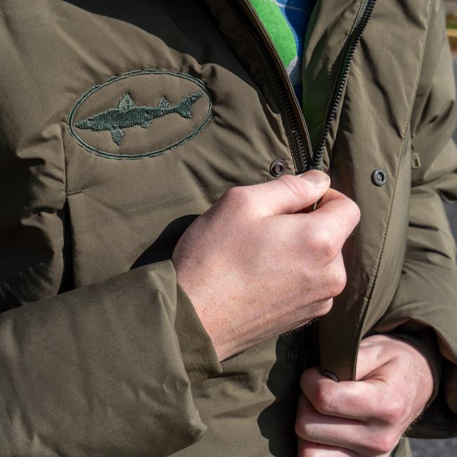 Dogfish Head and Patagonia Men's Olive Green Glacier Parka Front View with Dogfish Head White Shark Logo, Button Snaps, and Front Zipper