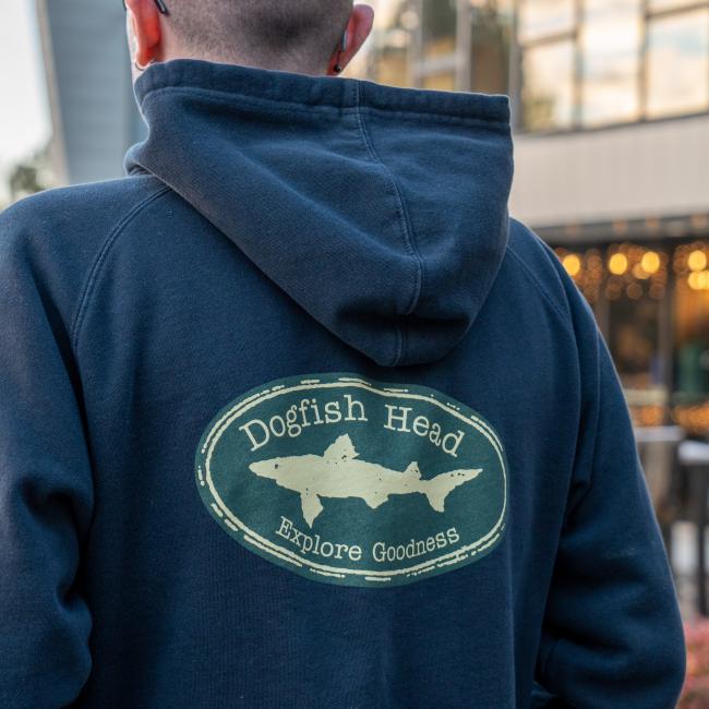 Back of Navy zip hoodie with green logo