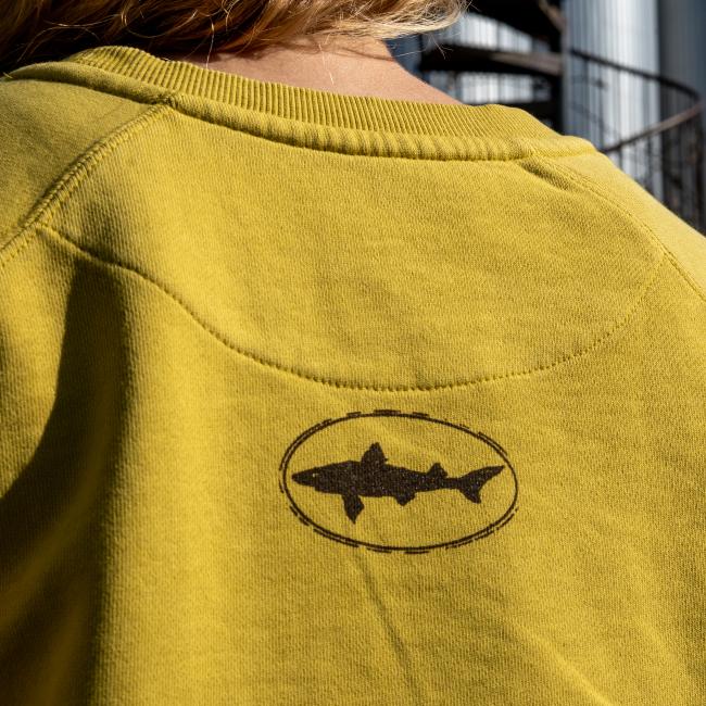 Dogfish Head Yellow Ashlyn Crew Sweatshirt Up Close Back View with Brown Dogfish Head Shark Logo In The Center of The Back