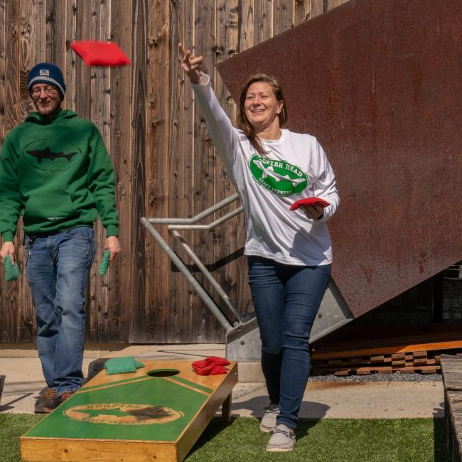 A white UPF long sleeve tee with the Dogfish Head logo on the front in green.