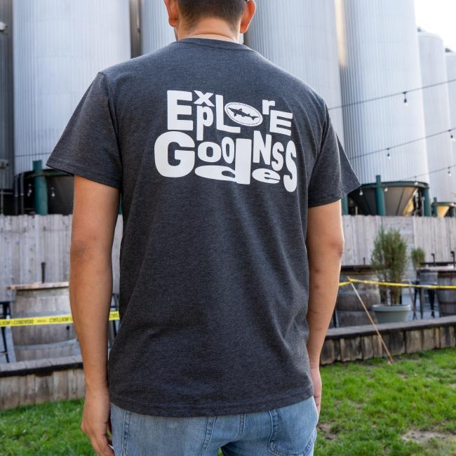 Charcoal Explore Goodness Tee in Dark Grey with Explore Goodness in White Lettering On Back