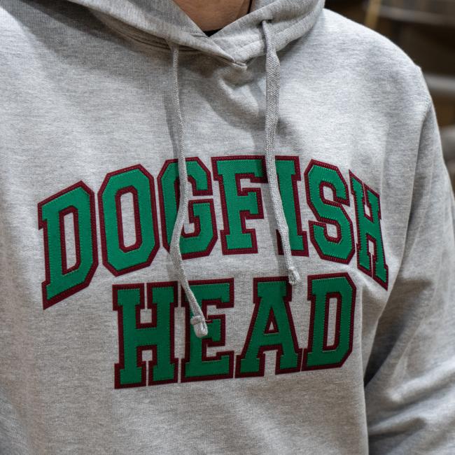Close up of Green Text Logo on hoodie