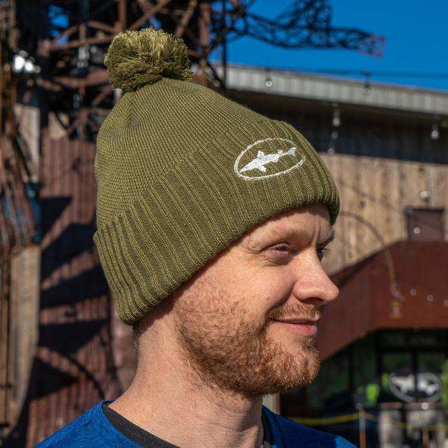 Dogfish Head and Patagonia Wyoming Powder Town Beaning in Green with Dogfish Head Shark Embroidered on The Front Worn By a Model 