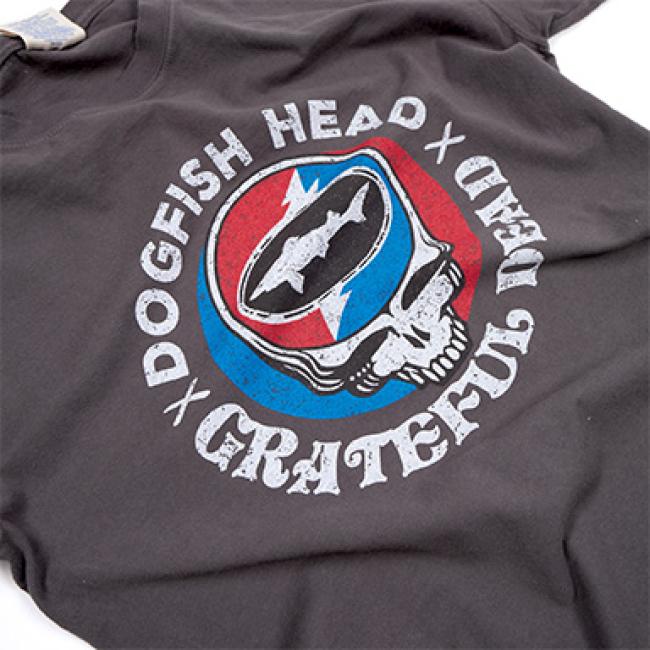 Close up view of the charcoal colored tee shirt with the Dogfish Head and Grateful Dead collaboration logo on the front.