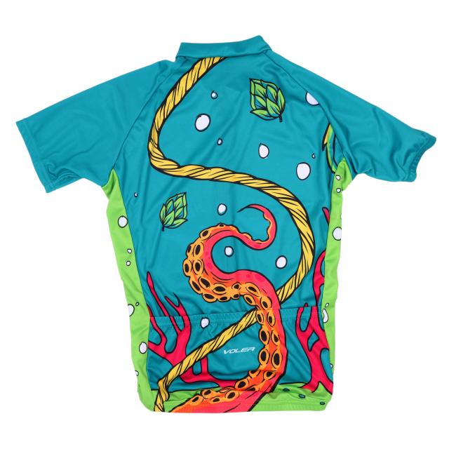 A vibrant short-sleeve cycling jersey with underwater-themed artwork, including tentacles, hops, and sea creatures. The front features the Dogfish Head “Explore Goodness” logo, surrounded by a rope graphic.